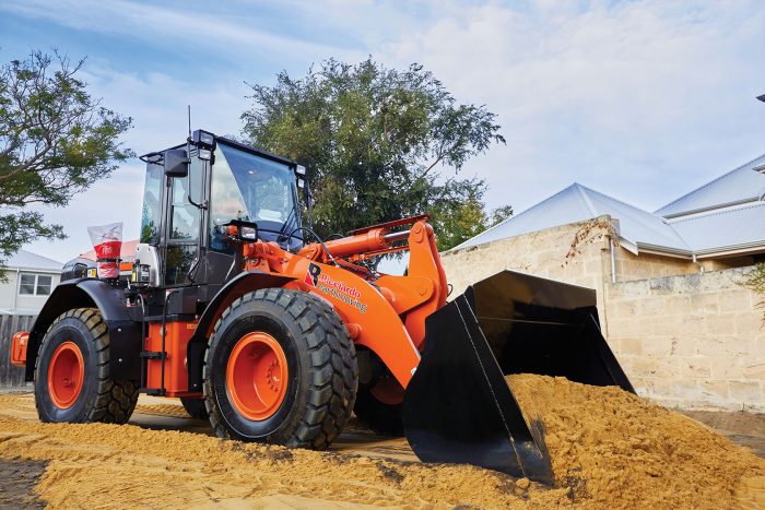 REMC Ricciardo Earthmoving front-end loader clearing residential block